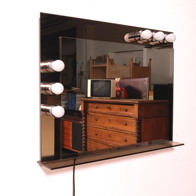 Beautiful original vintage mirror from the 1970s, with double glass, the outer one is smoked, the other is a plain mirror....