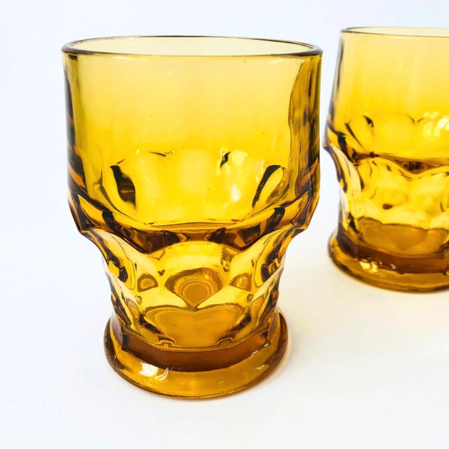 A set of 2 vintage amber cocktail glasses. Made in the "Georgian" pattern by Anchor Hocking. Nice faceted bases with a...