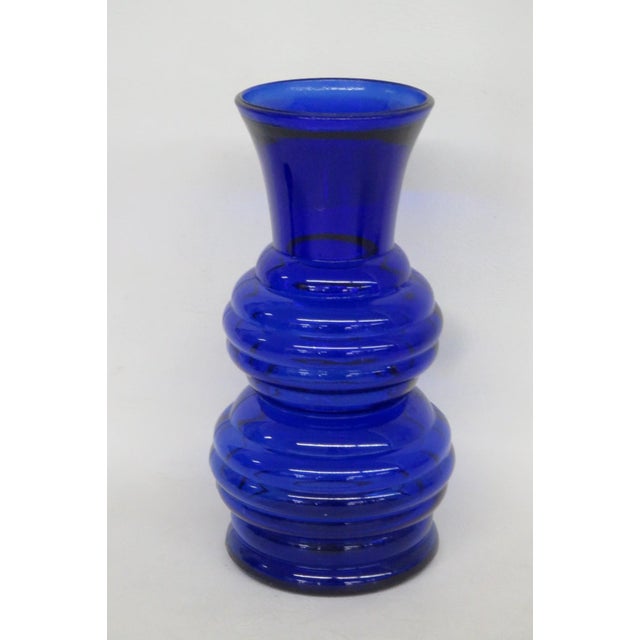 This beautiful Vase is made out of pressed glass. This gorgeous vase features a double-stacked beehive design with ribbed...