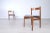 Pair of chairs model 101 designed by Gianfranco Frattini, original Cassina production, under the seat of both is the...