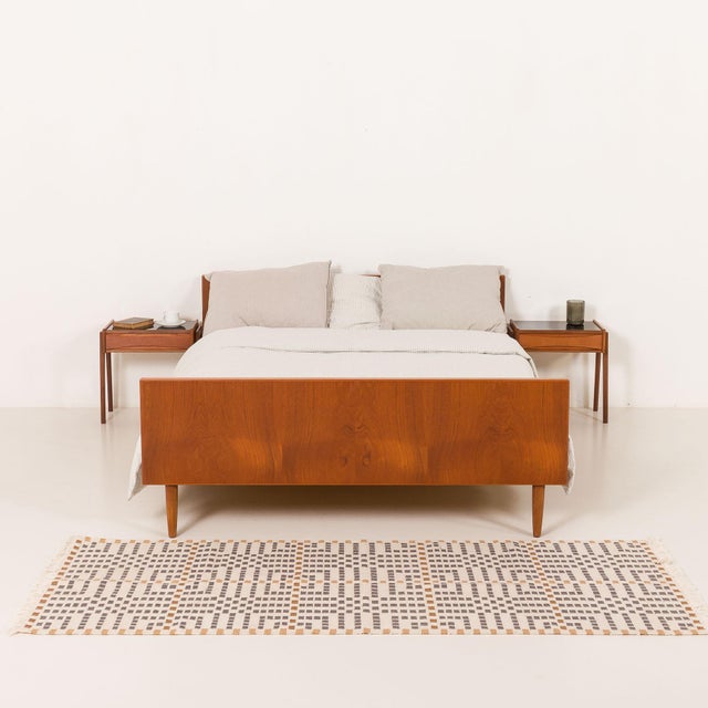 This danish teak bed, designed very closely to the style of hans j. Wegner, comes from the 1960s and exemplifies the...