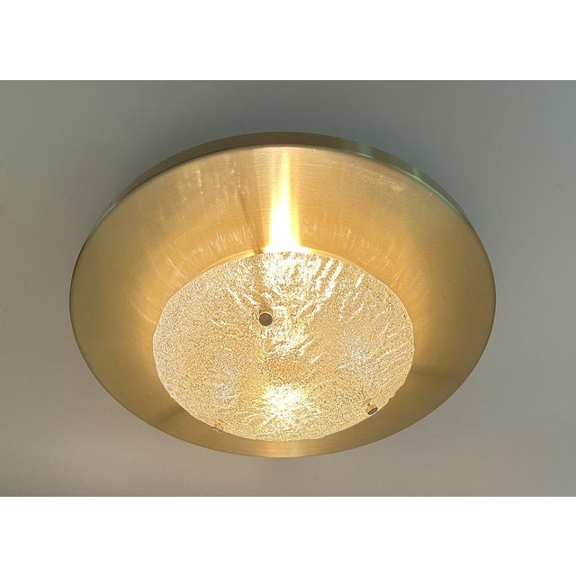 Very large Vintage mid century architectonic light, featuring an anodized light gold disc with a center murano glass cover...