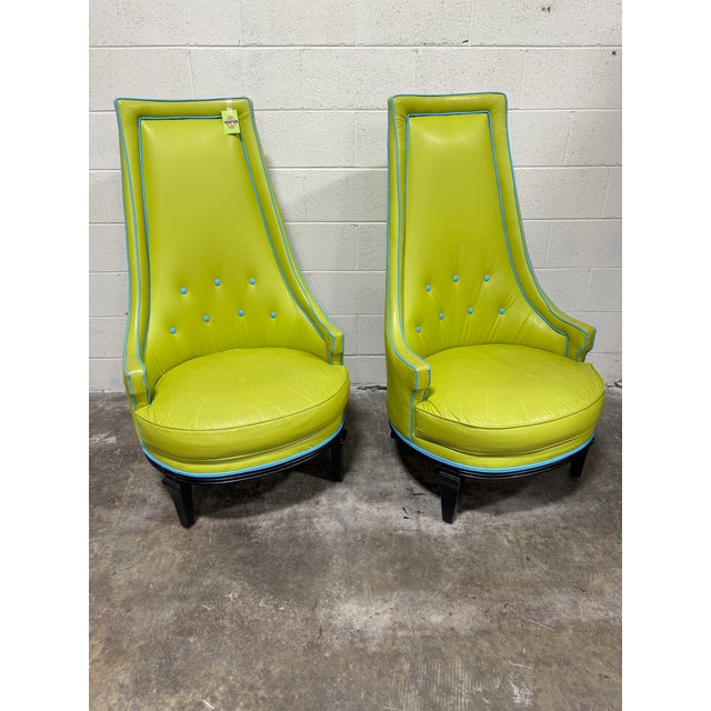 Custom pair of leather high back chairs in chartreuse green (or lime) with blue piping and buttons. No maker name. Great...