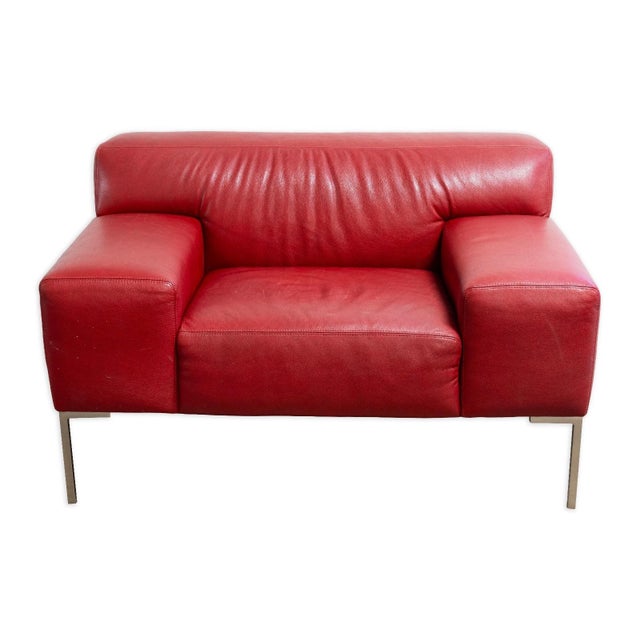 This Contemporary American Leather Tuscany Chair features a bold, architectural silhouette upholstered in rich red leather...