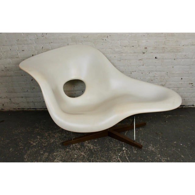 This the the La Chaise chair designed by Charles and Ray Eames and produced by Vitra. The piece is made up of sculpted...