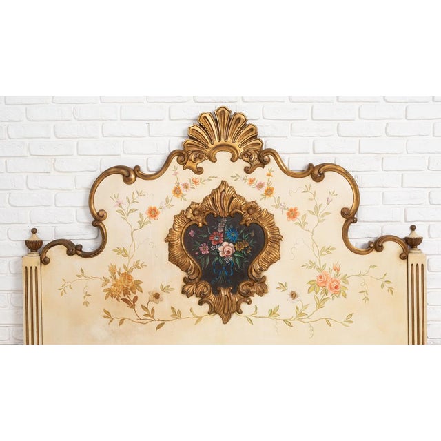 Charming vintage three-piece bedroom set consisting of a large decorative headboard and two matching nightstands, finished...