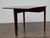 This English oak table, circa 1800, is a fine example of Georgian-period craftsmanship, blending refined simplicity with a...