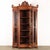 Showcase supported by turned feet, has a broken front with a central door, glass on the sides and sides. In walnut carved...