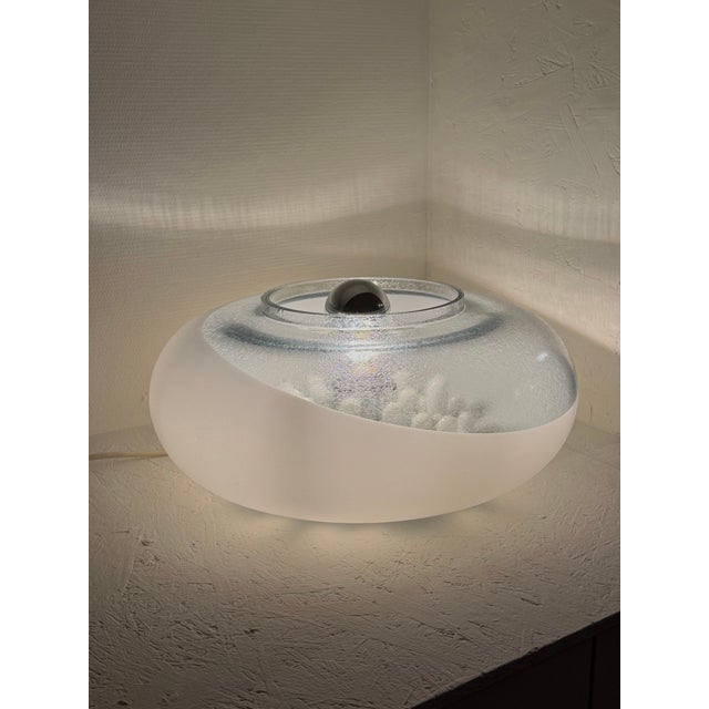 This Murano glass lamp is a beautiful example of Italian Space Age design. It features a spherical cylinder with small,...