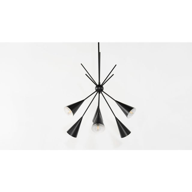 The "Bouquet" six arm chandelier is a stunning statement piece with design elements of both Italian or French modernism...