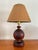 1950s wooden marquetry studio crafts lamp with original woven shade. Base is 4.5” in diameter Measurement includes shade