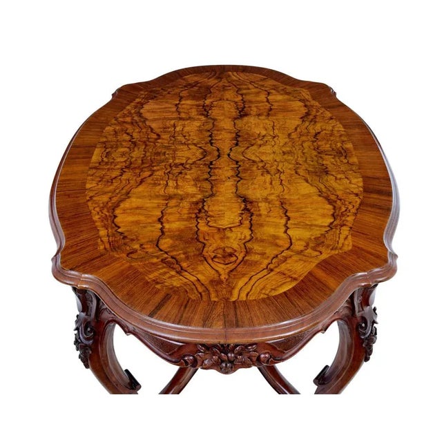 19th century carved walnut occasional table circa 1890. Fine quality rococo revival swedish made table. Dimensions of this...