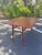 Mid-century Danish Modern fold-down dining table. A perfect table for a quaint dining space. Two fold-down leafs on a...