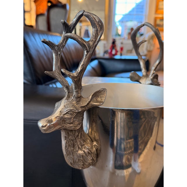 A fabulous, decorative champagne/wine bucket on stand. Stag heads on the sides. Perfect to fill with ice for champagne,...