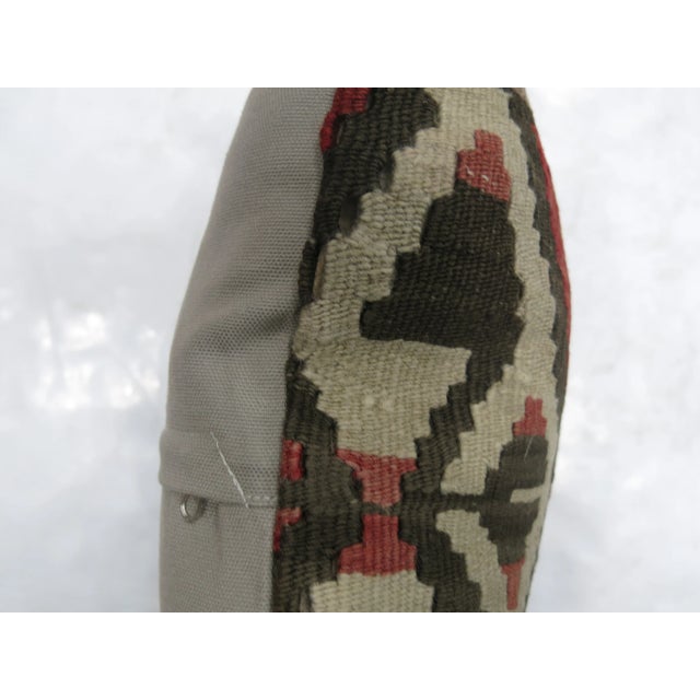 One of a kind Pillow made from a vintage turkish kilim with cotton back. Zipper closure and foam insert provided. 17'' x 18''