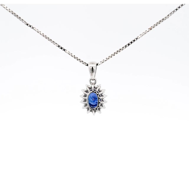 2010s Natural 1.20 Carat Oval-Cut Blue Sapphire and Diamond Halo Pendant Necklace For Sale - Image 5 of 8