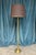 This French 1940s brass and bronze neoclassical style floor lamp features a hexagonal base supporting a delicately fluted...