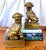 A pair of large brass Foo Dogs on pedestals decorated with a Chinese fret design. Mid 20th century. Nice detail to casting...
