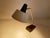 Kaiser Desk lamp, Modell 6813, 1960s, featuring a cantilivered black enameled cast iron base, brass stem and superimposed...