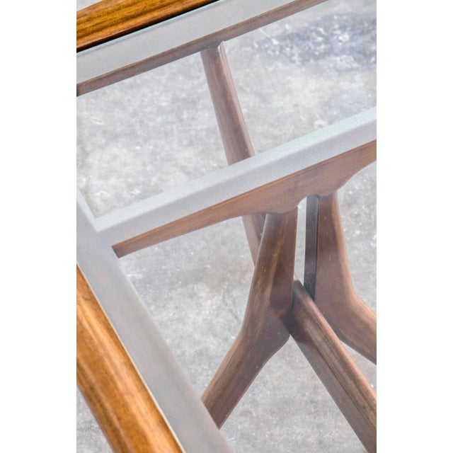 Coffee table by Italian designer Cesare Lacca for Cassina, made in the early 1960’s. Made of cherry wood with a glass top....