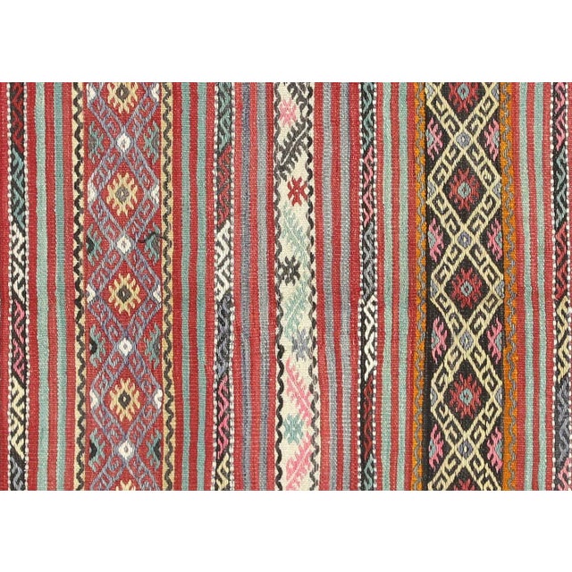 Bring a unique and traditional style to your home with this handcrafted Vintage Turkish Kilim. Boasting a classic wool-on-...