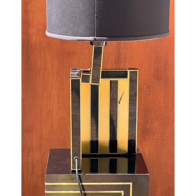 A cityscape table lamp by BD Lumica, probably designed by Willy Rizzo, Spain circa 1970. This lamp features a mosaic esque...