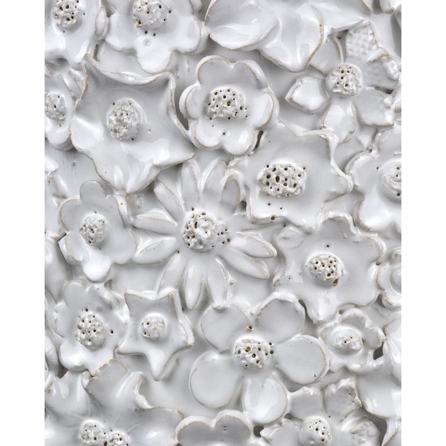 With a surface that is studded with beautifully fashioned white flowers, the Jessamine White Side Table is truly an...