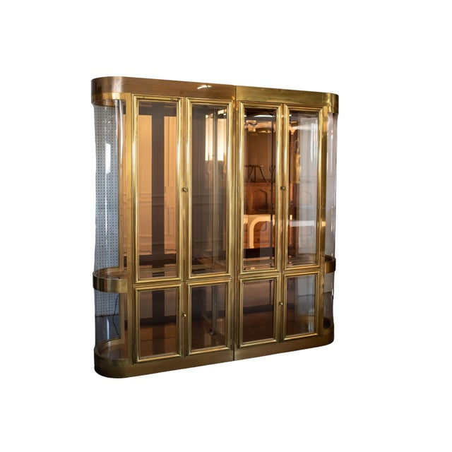 The two sections fit together seamlessly, finished in brass for a bold yet refined presence. Curved lucite sides add a...