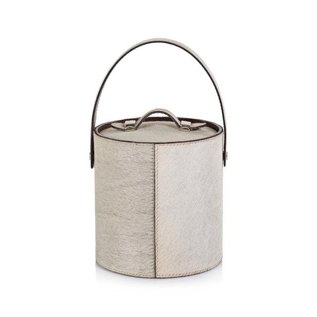 Enhance your entertaining experience with the Bilthoven Hair-On-Hide Leather Insulated Ice Bucket. This exquisite piece...