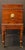 George IV period circa 1820 cellarette on stand, English. Flame mahogany. Integral stand with Trafalgar rope molding &...