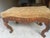Antique serpentine mahogany fireside bench. Probably from the 1900's possibly French. Ornate floral carving on the...