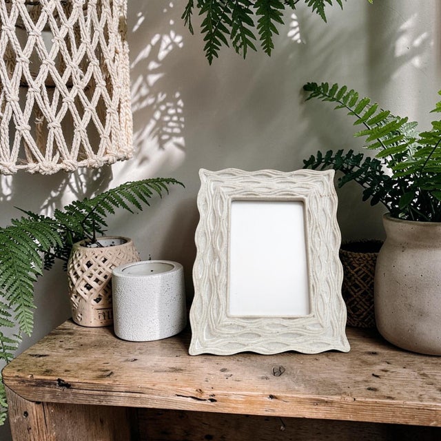 Elevate your home decor with the Carved Stone Wavy Textured Picture Frame, a stunning blend of natural elegance and...