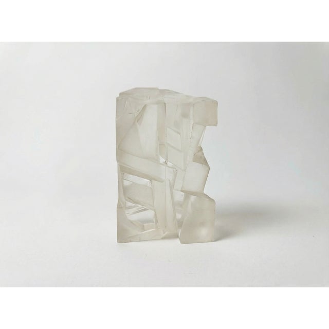 Striking vintage Lucite sculpture from the 1980s with a carved, abstract form blending frosted and glossy finishes. The...