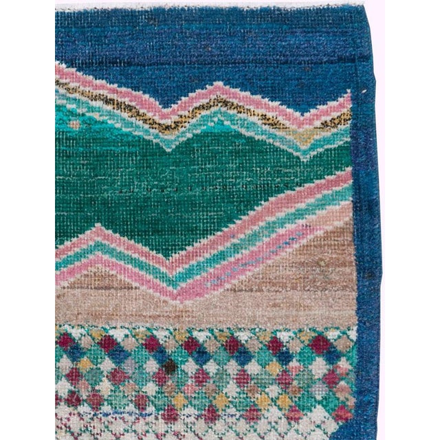 This mid-20th-century Turkish Anatolian square rug presents a striking, almost pictorial composition centered on a large...
