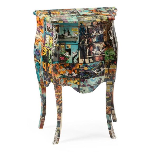 Striking pair of French-inspired commode-style nightstands featuring an unexpected comic book print finish that blends...