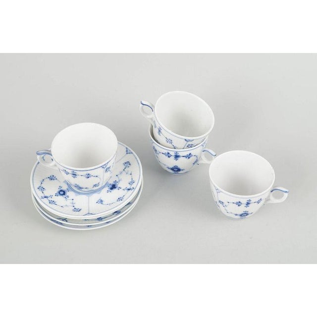 Royal Copenhagen Blue Fluted Plain, set of four coffee cups with saucers. Four coffee cups with matching saucers in...