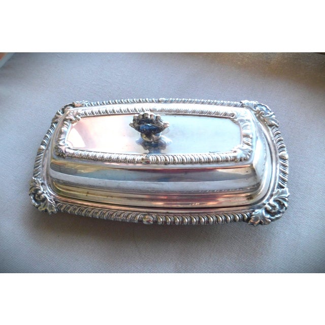 1940's English Hallmarked Vintage Silver Plated Repoussed Butter Dish with beautifully designed top and bottom. The piece...