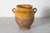 This 19th-century Spanish pottery jar beautifully captures the rustic charm and artisanal craftsmanship of the...