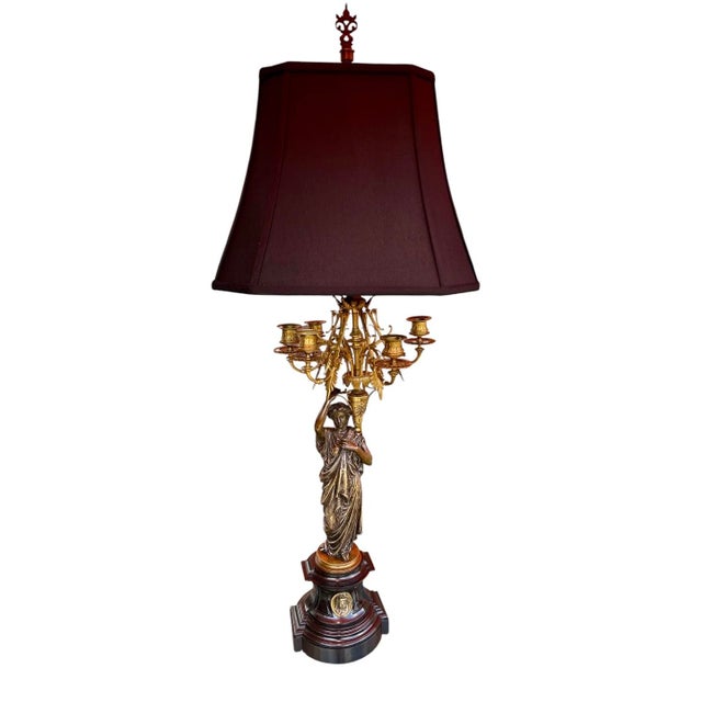 This elegant pair of French Neoclassical figural candelabra/lamps, crafted circa 1870, exemplifies the refined taste and...