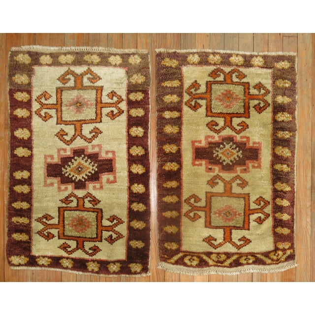 A matching pair of mid-20th century Turkish Kars rugs with tribal motifs Both Measuring 22” x 33”