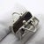 This vintage silver decorative object depicts a lady's handbag fashioned as a functional miniature box, crafted as a...