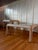 Beautiful vintage 1970s pair of sculptural pencil reeded rattan tables, featuring a distinctive waterfall silhouette and...