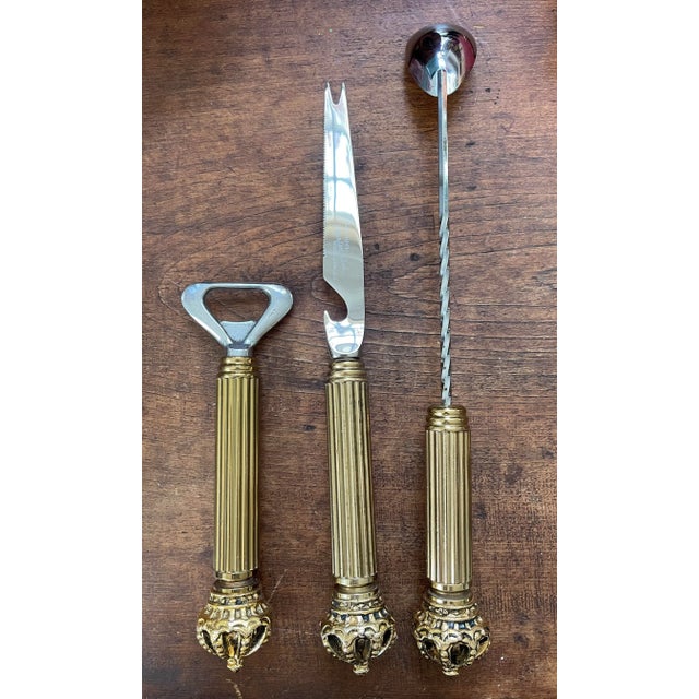 This is a very handsome and well made bar tool set! Made in the 1960s this set of three brass bar accessories is...
