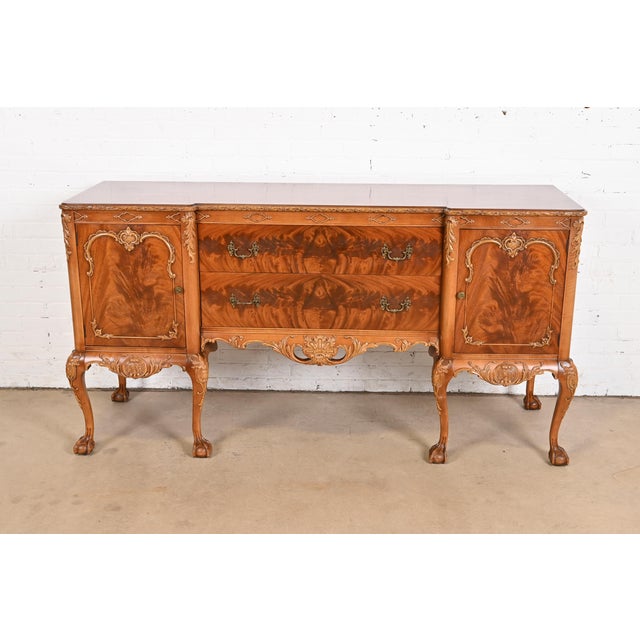 An exceptional Chippendale or Georgian style ornate carved sideboard buffet or credenza By Romweber USA, Circa 1920s...