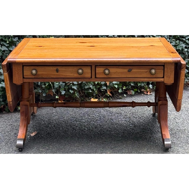 Charming coffee table by Broyhill from their “Yorkshire Market” collection. Features a planked top and two drawers on one...