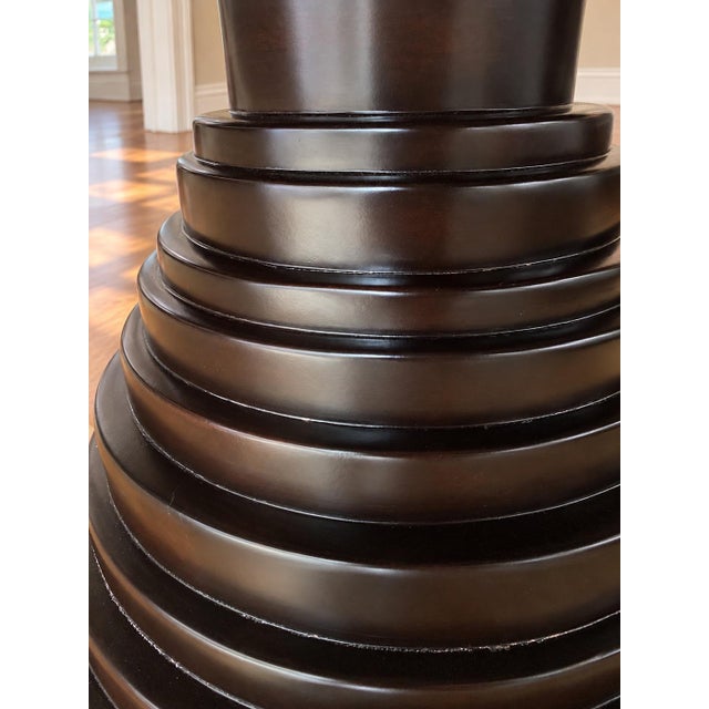Offered is a striking "Ibiza" round pedestal dining table by premier custom trade manufacturer Hammer Fine Furniture (Bell...