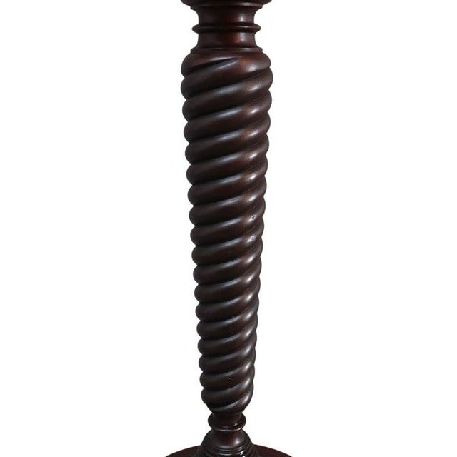 This antique pedestal stand, attributed to RJ Horner, is crafted from carved mahogany and dates to approximately 1910. The...