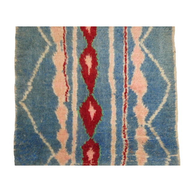 Vintage Moroccan runner hand woven in blue, red and pale pink wool in an abstract Berber pattern. Dimensions: 2'6 x 9'8