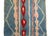 Vintage Moroccan runner hand woven in blue, red and pale pink wool in an abstract Berber pattern. Dimensions: 2'6 x 9'8