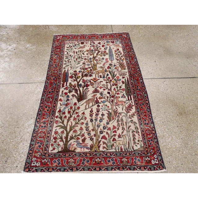 A vintage Persian Tabriz throw rug handmade during the Mid-20th century. Measures: 2' 8" x 4' 5"